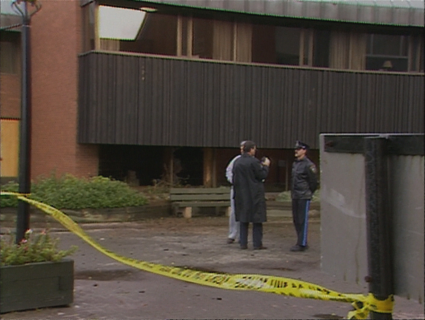 The pipe bomb was placed behind the bushes in a flower bed. The judges' chambers are directly above on the second floor. (CBC)