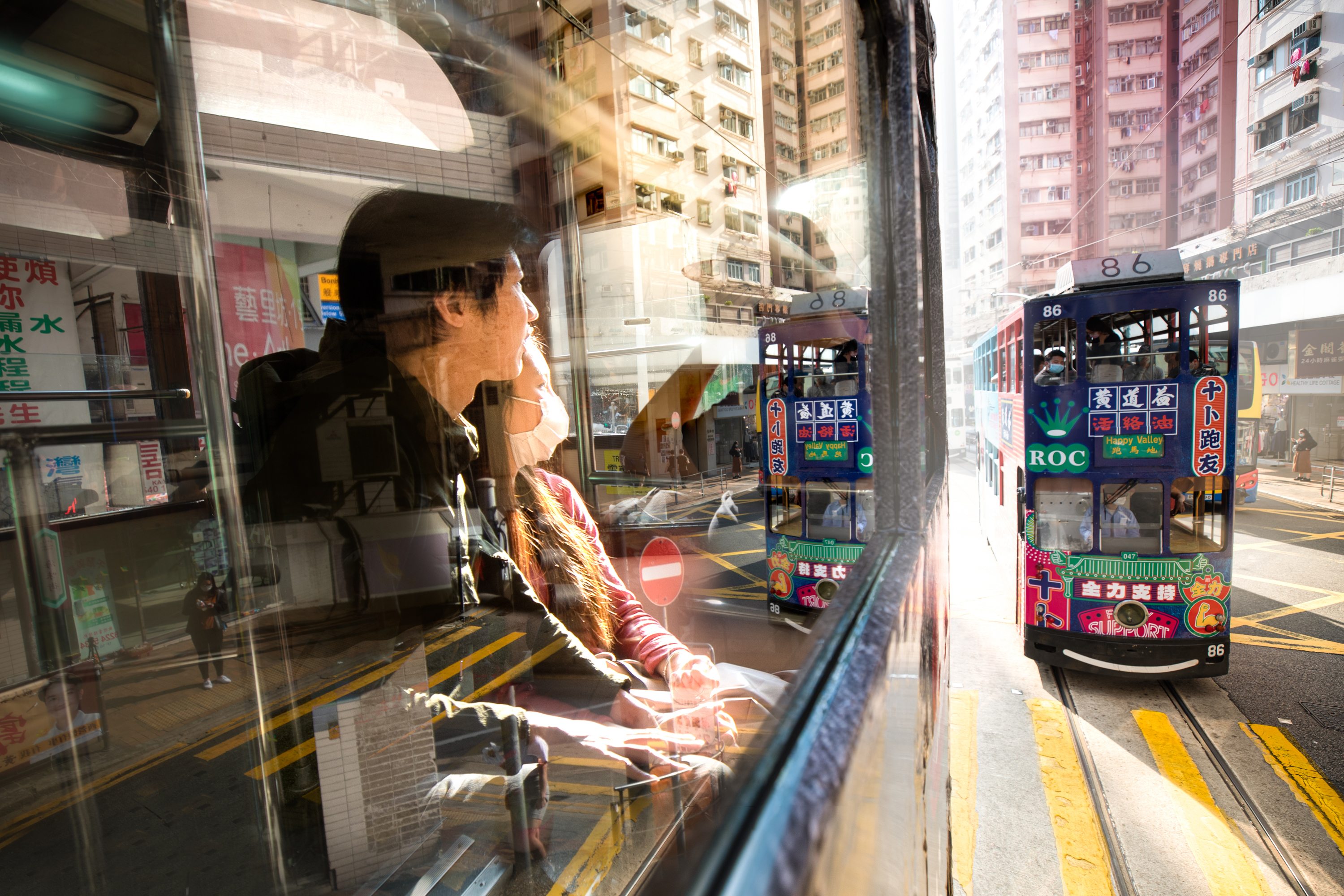 Mask shortages in Hong Kong kept some from wearing masks, but otherwise it became a badge of honour, communicating solidarity and civic responsibility. (Saša Petricic/CBC)