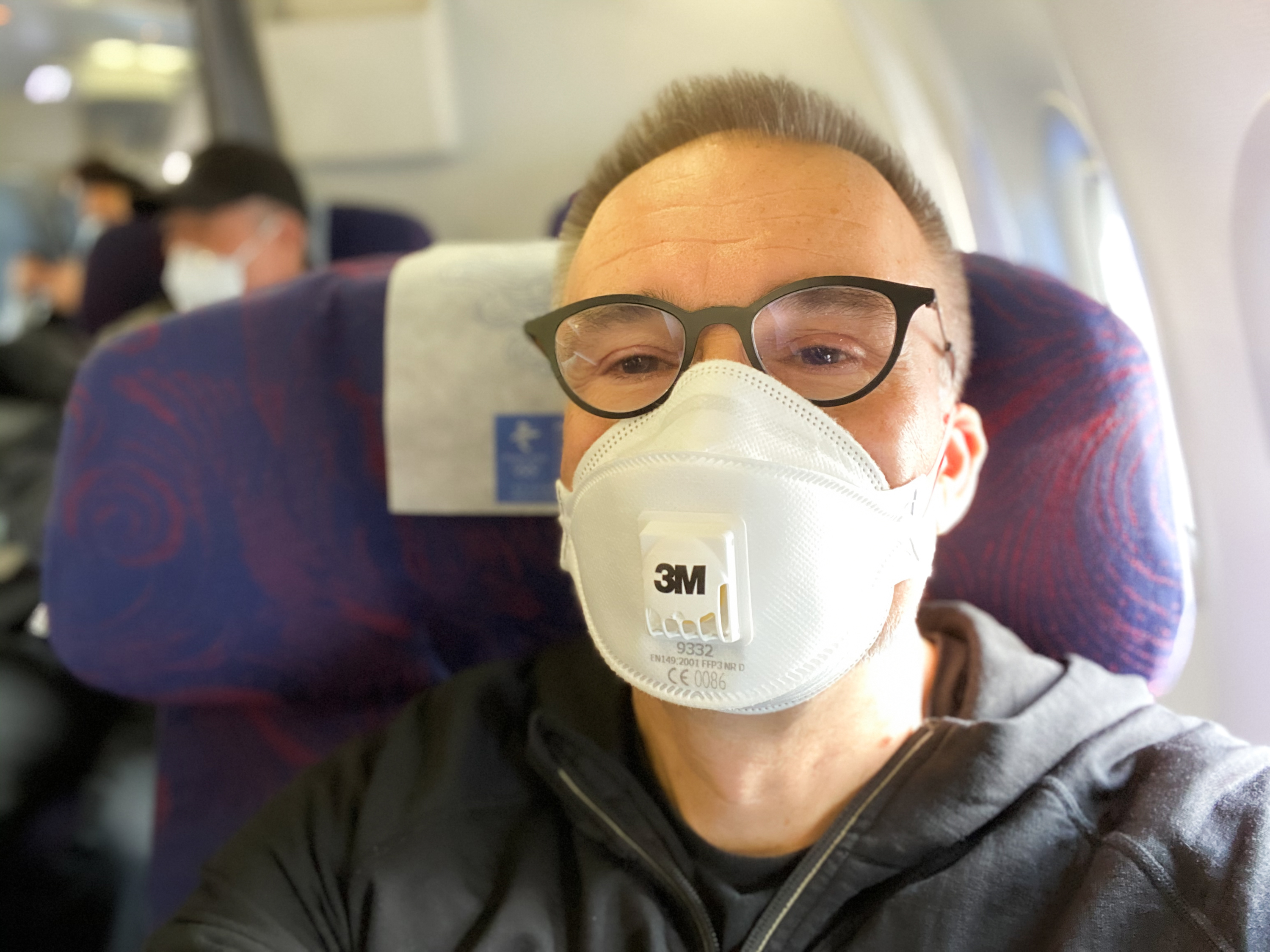 CBC correspondent Saša Petricic aboard one of the last flights from Beijing to Hong Kong before strict quarantine rules started for arrivals into Hong Kong in February. (Saša Petricic/CBC)