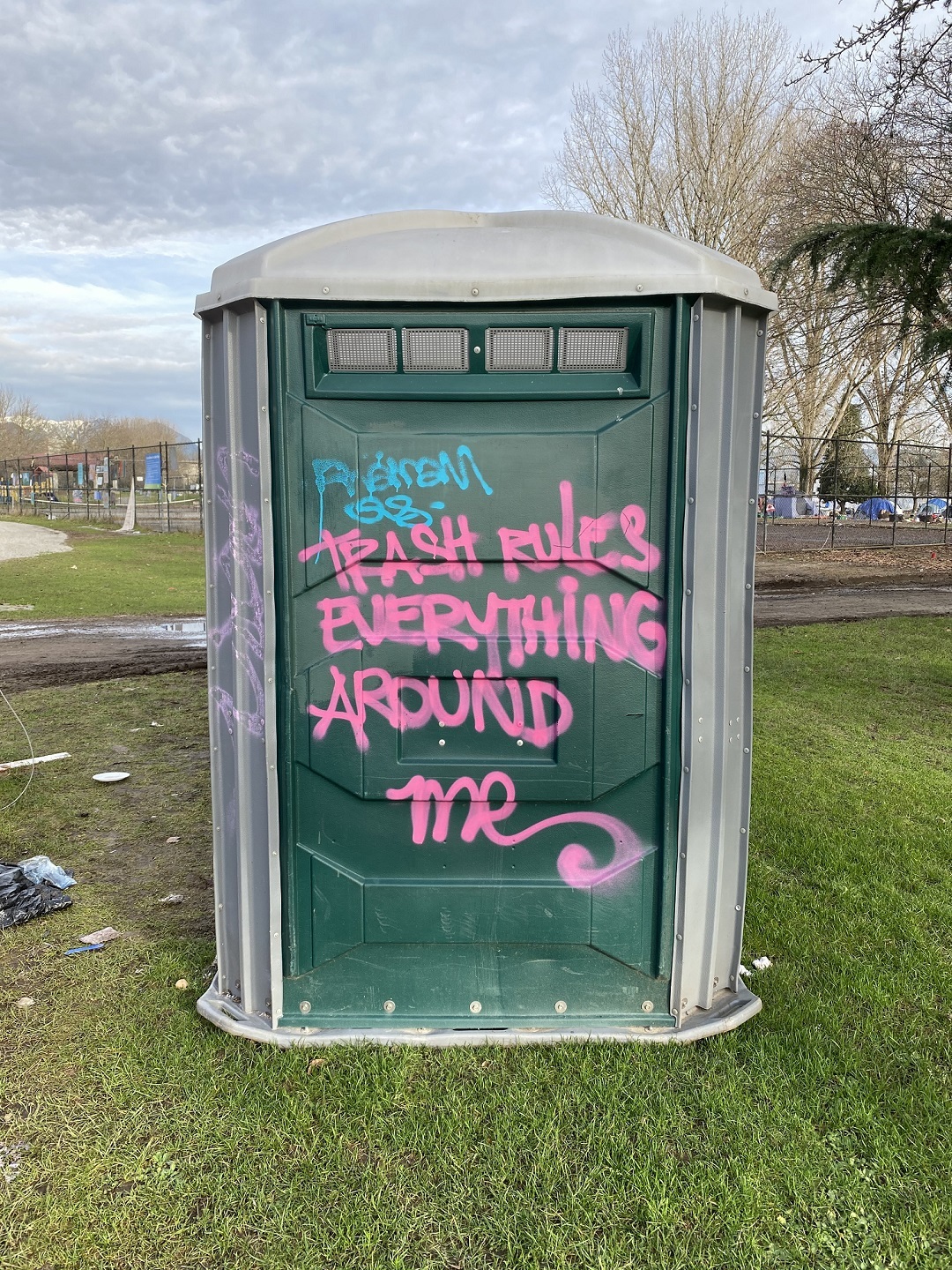 Graffiti scrawled on a portable toilet captures the sentiment of some about the state of Strathcona Park. (Stephen Quinn)