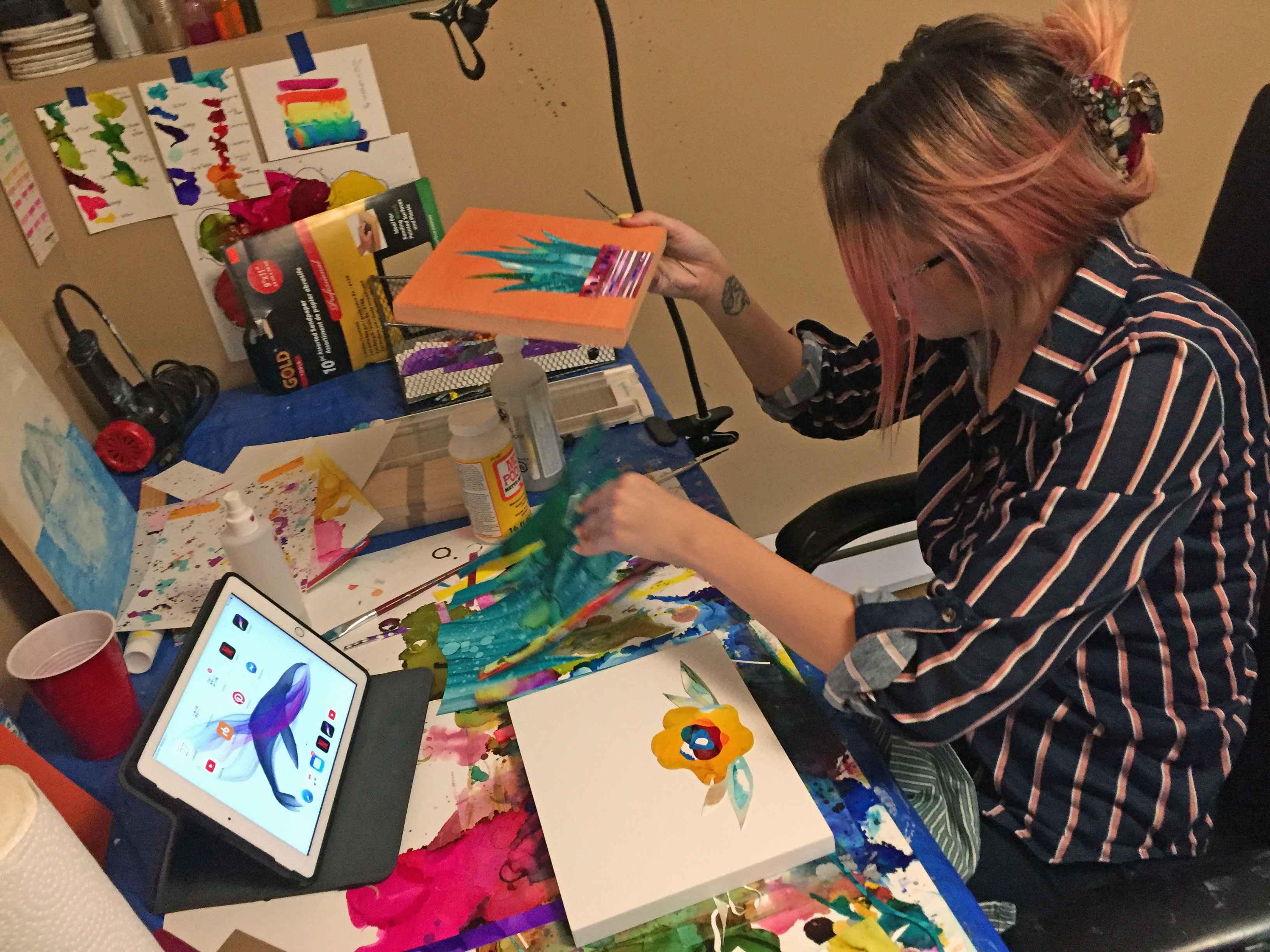 Sara Dillon's work station in her basement is a colourful, hectic mess, and she loves it. (Stephanie Tobin/CBC)