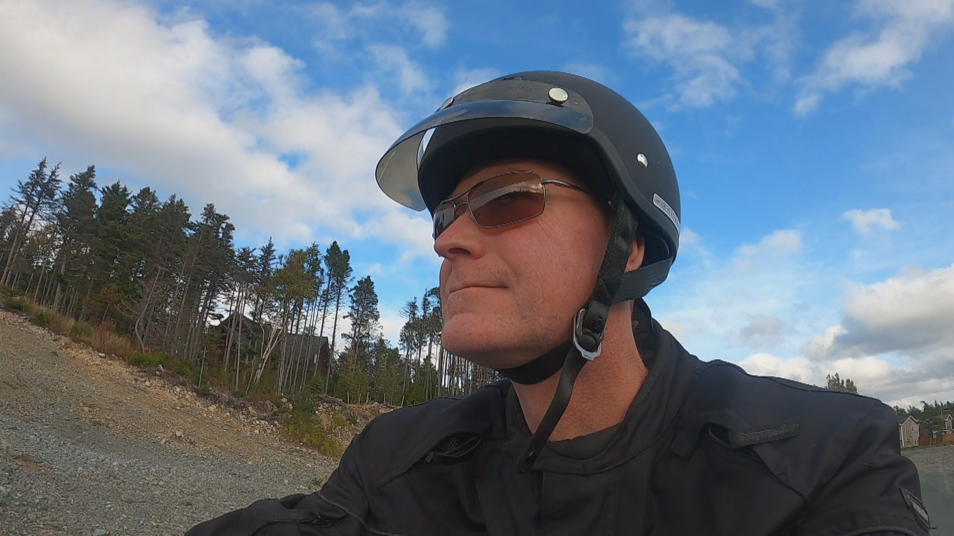 Burridge rides his motorcycle near his home in Portugal Cove-St. Philip's. (Sherry Vivian/CBC)