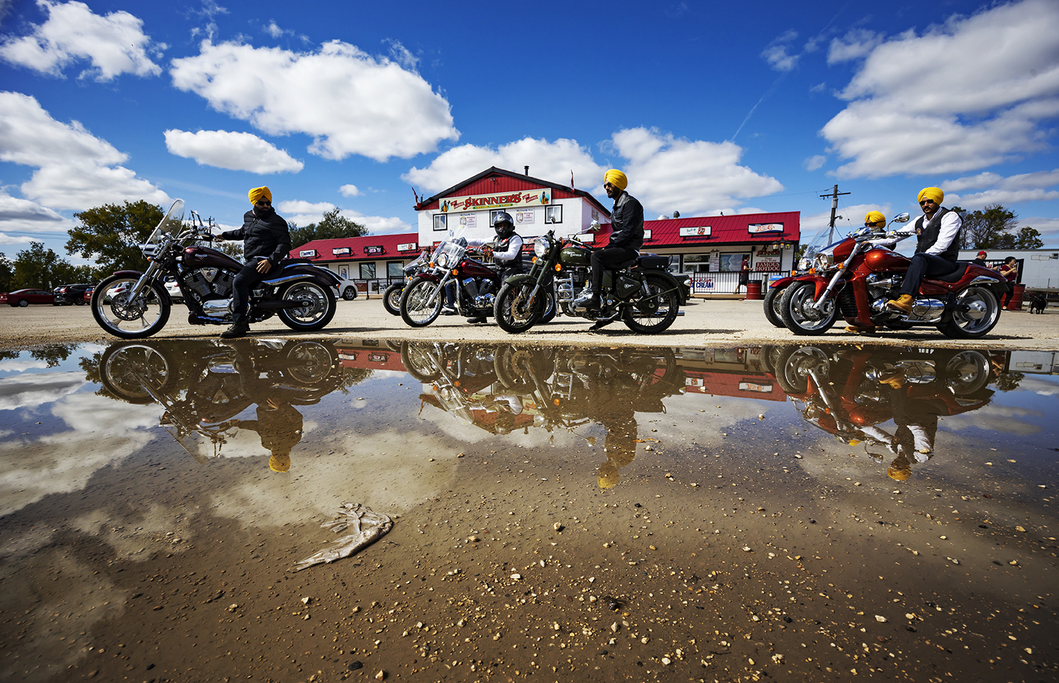 Bikers can be seen gathering at Skinner's in Lockport, Man., before moving on to their next destination. (Prabhjot Singh Lotey/CBC)