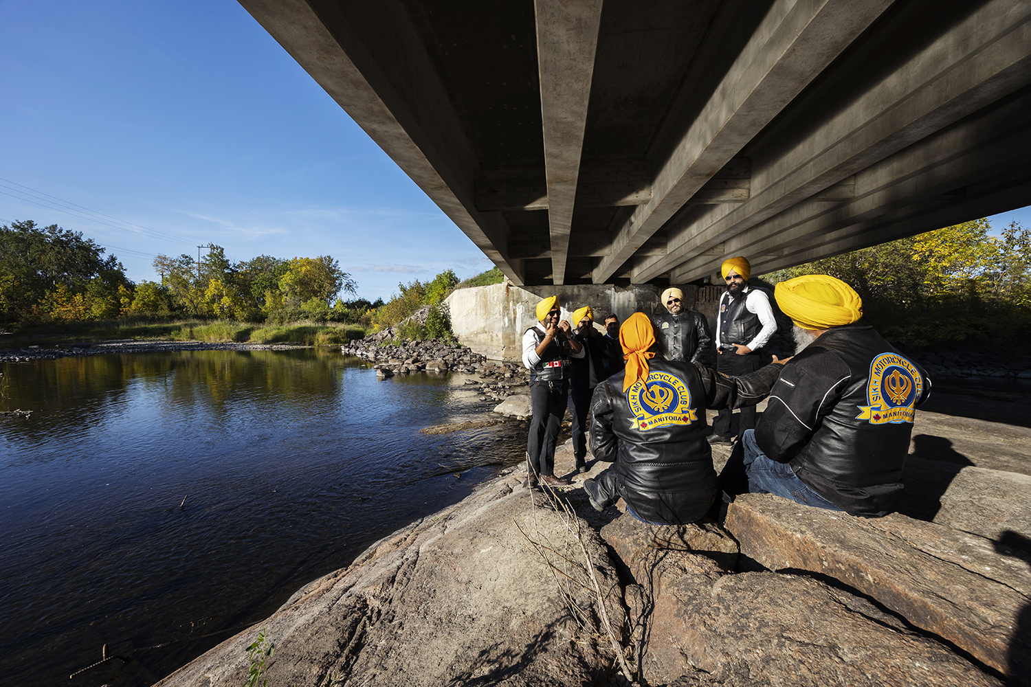 After a particularly long stretch riding more than 200 kilometres, the group decided to stop at a peaceful spot under a bridge at the Elma Rapids in Manitoba. (Prabhjot Singh Lotey/CBC)