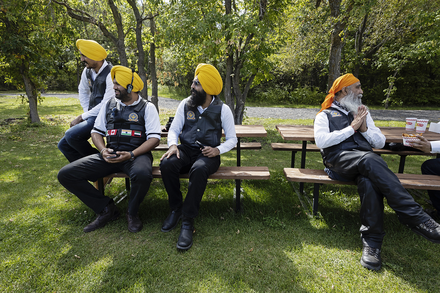 Members of the Sikh Motorcycle Club of Manitoba wait for their food at Half Moon restaurant near Lockport, Man. It is a popular location among bikers to stop for refreshments and rest. (Prabhjot Singh Lotey/CBC)