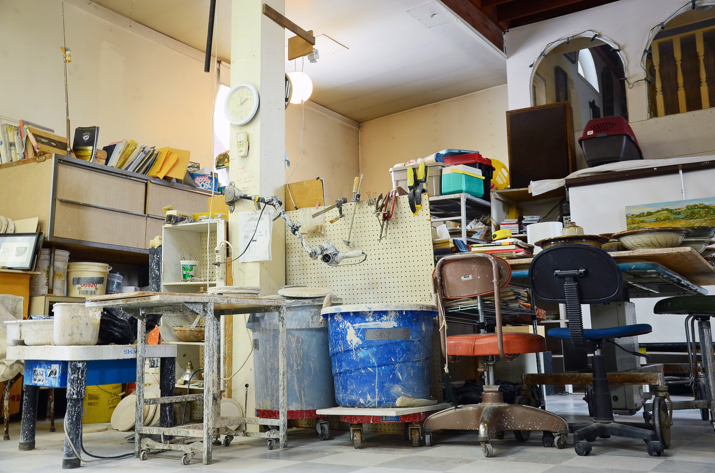 Every surface in Mel Bolen's workshop at the Northstar Art Gallery is covered in clay and ceramics. (Bridget Yard/CBC)