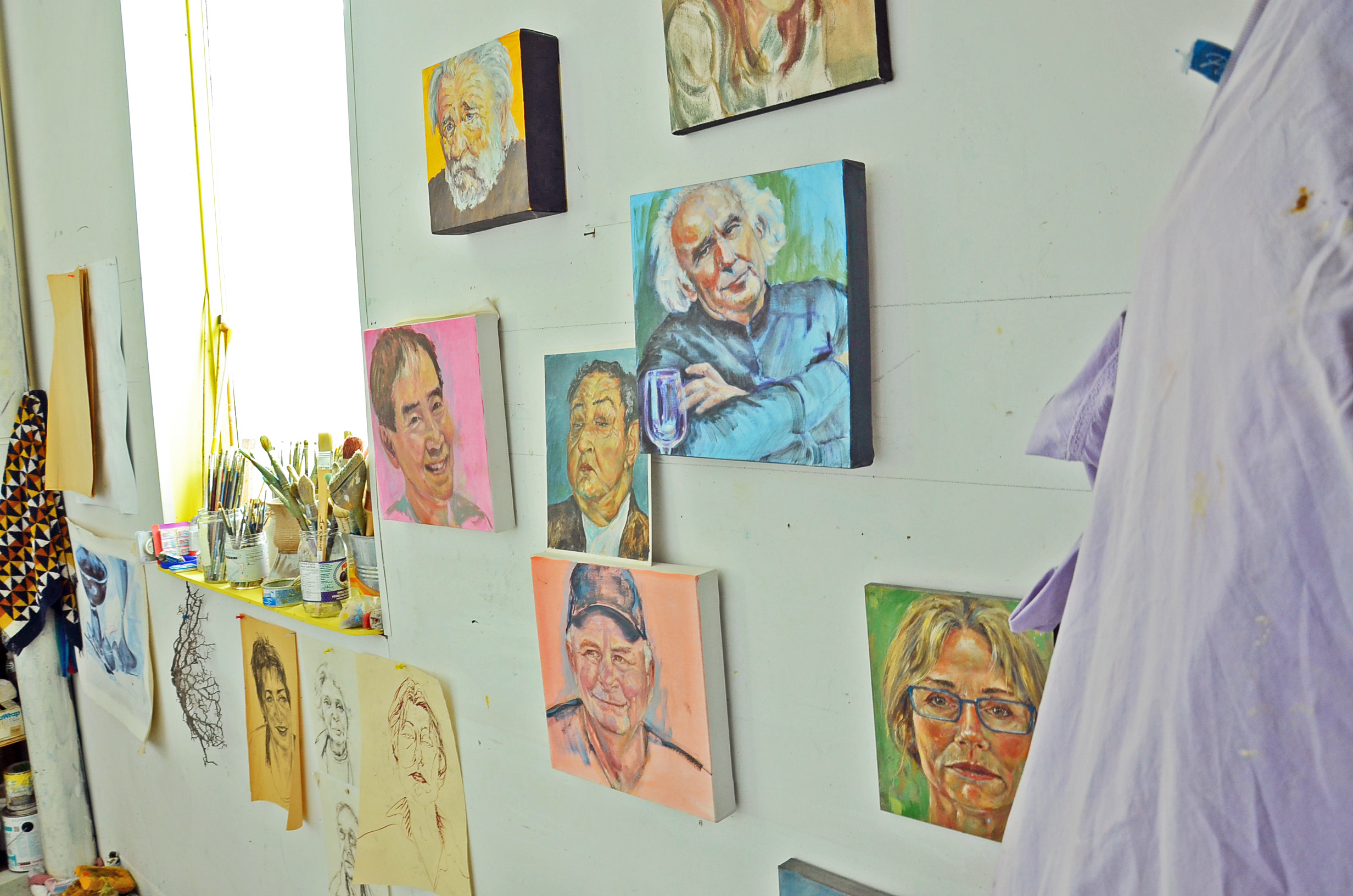 Karen Holden has a small corner of the Northstar studio, where she paints portraits and landscapes (Bridget Yard/CBC)