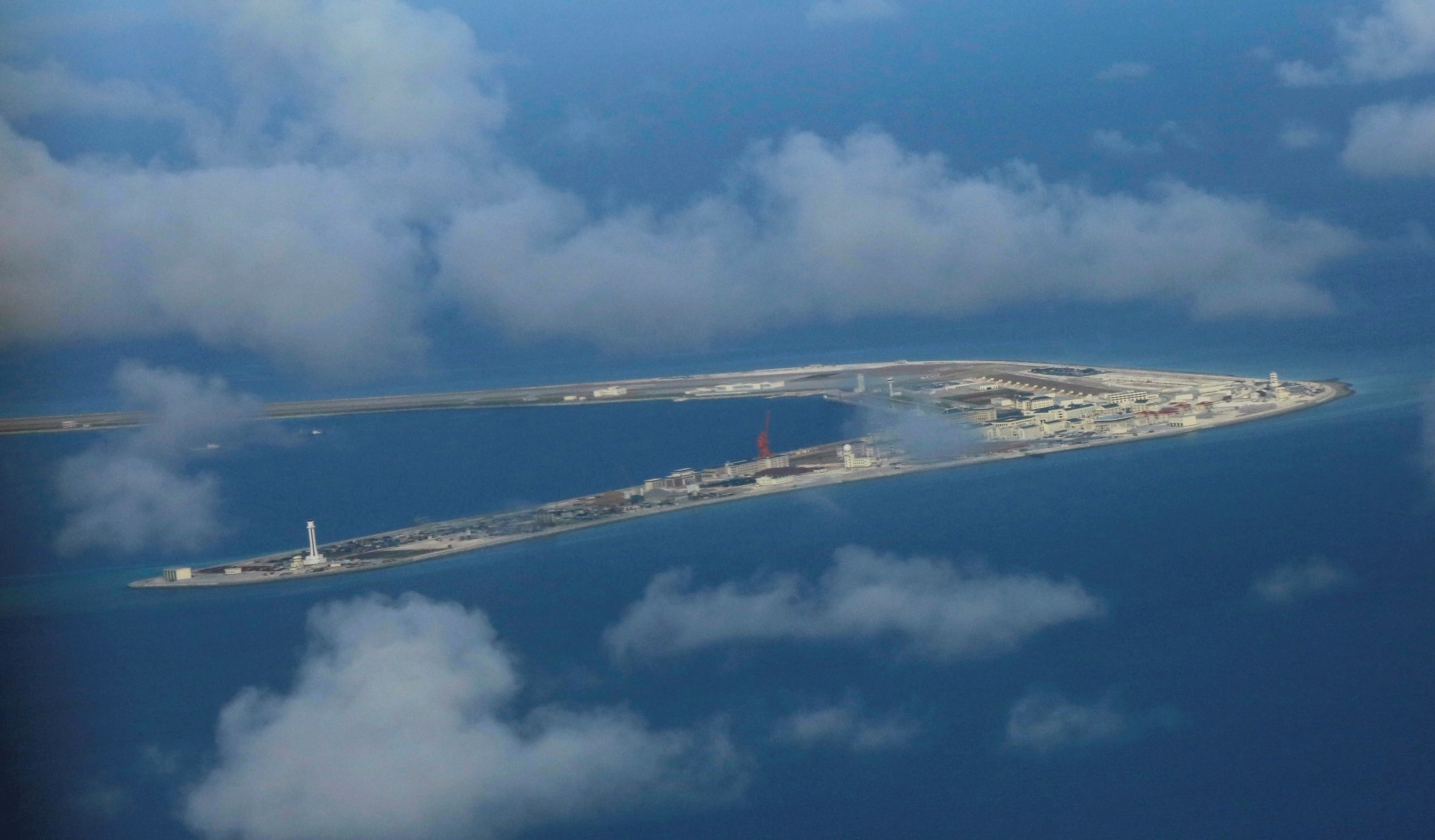 An aerial view of China-occupied Subi Reef at Spratly Islands in the disputed South China Sea. China has tried to assert its territorial claims on the contested waters by militarizing them with aircraft strips, harbours and radar facilities. (Francis Malasig/Reuters)