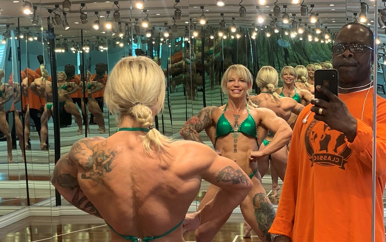 A female bodybuilder undergoing intense muscle growth, showcasing