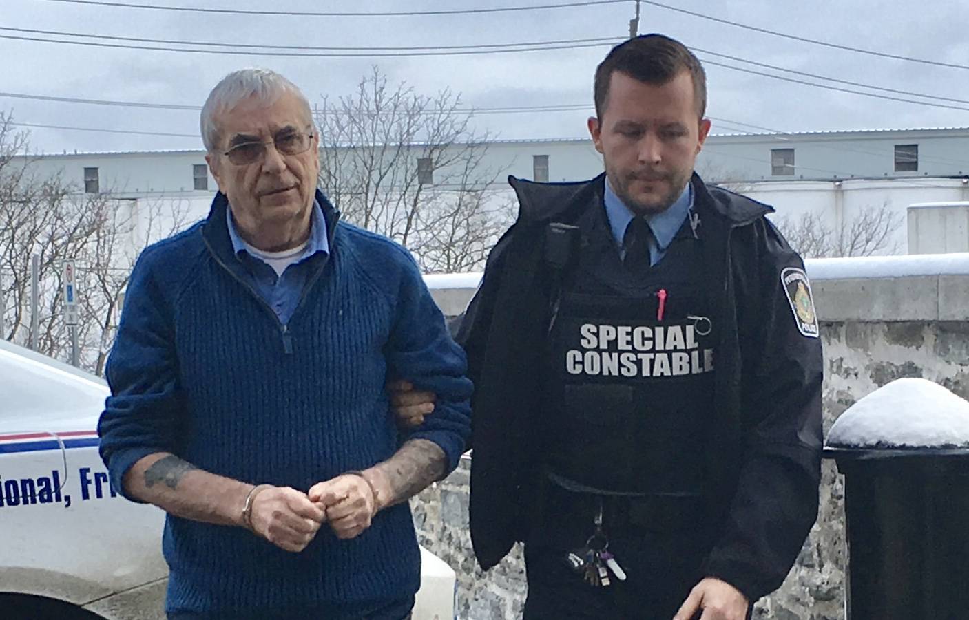 Terrance Finn, left, is led to Superior Court in Peterborough on Jan. 6, 2020. (Global News)