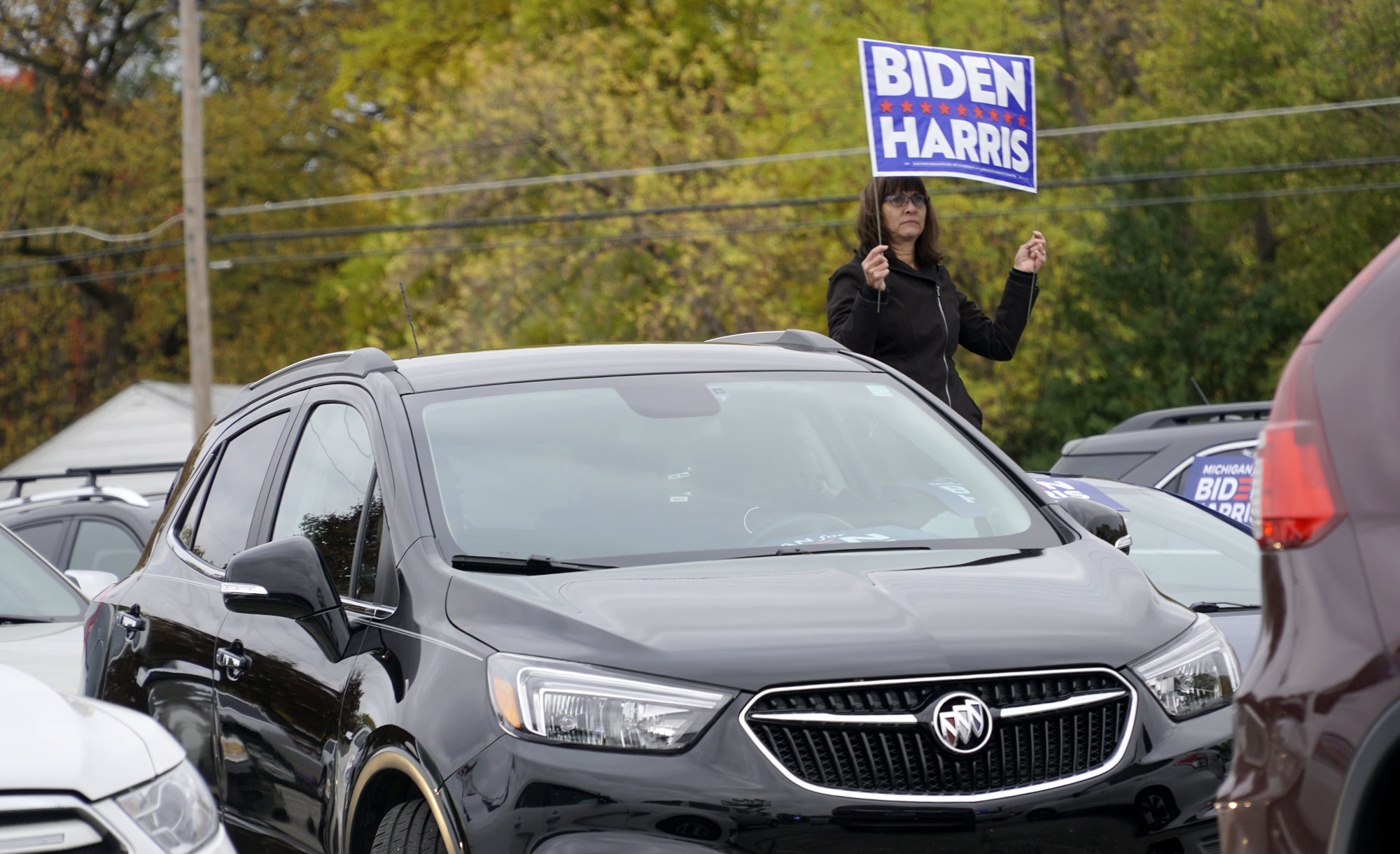 Michigan supporters of Joe Biden and vice-presidential candidate Kamala Harris recently attended a 'drive-in rally' hosted by Biden's wife, Jill, in a parking lot in Saginaw. (Mark Gollom/CBC)