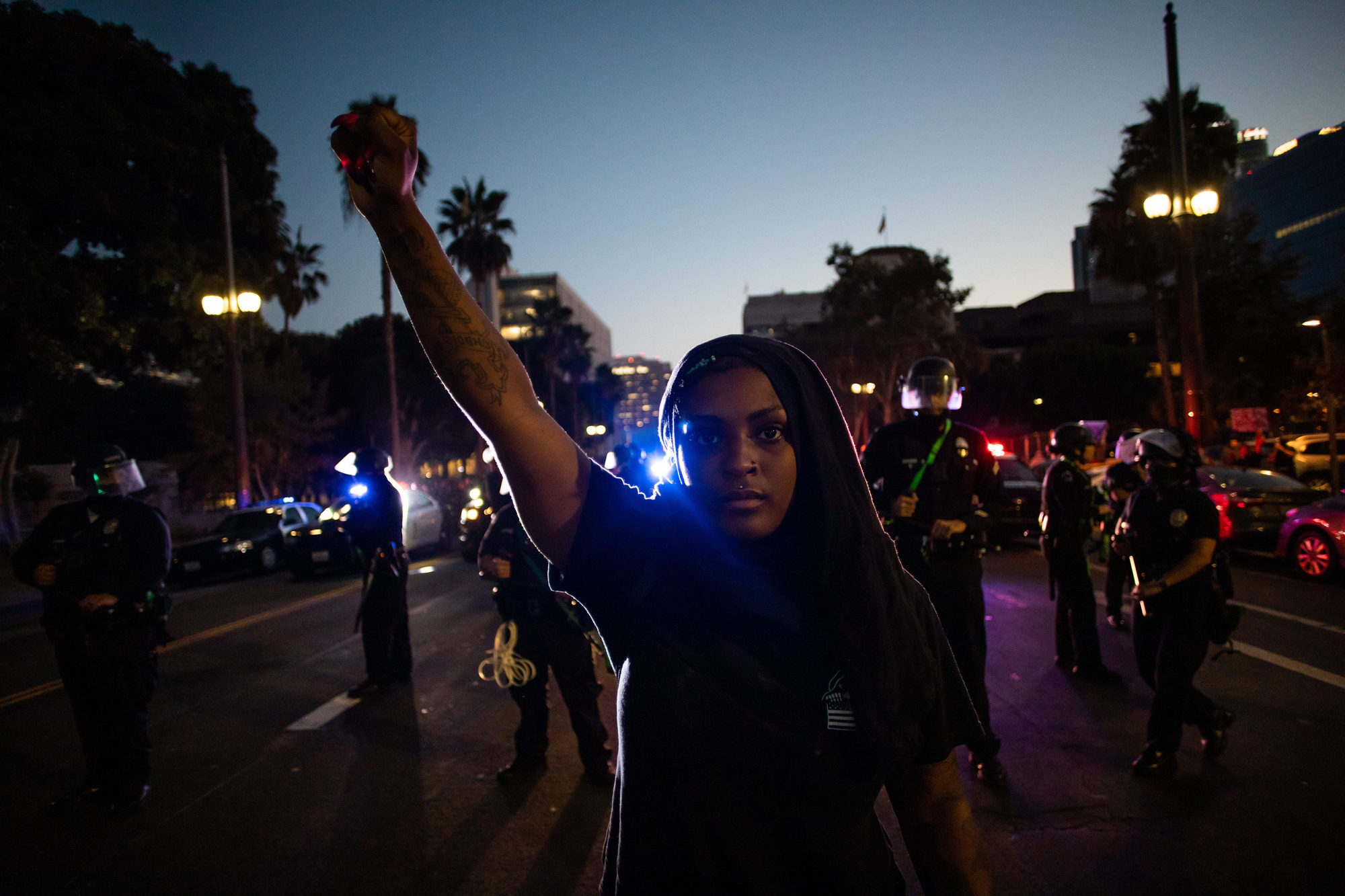 The killing of George Floyd by a Minneapolis police officer in May inspired months of protests across the U.S. Both images above show demonstrators at a protest in downtown Los Angeles in July. (Apu Gomes/AFP/Getty Images)