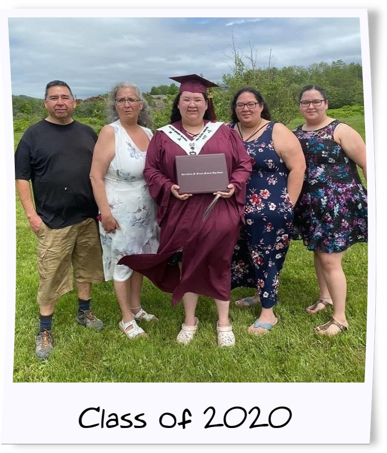 Jolie Jeddore accepts her diploma with her family. (Submitted by Jolie Jeddore)