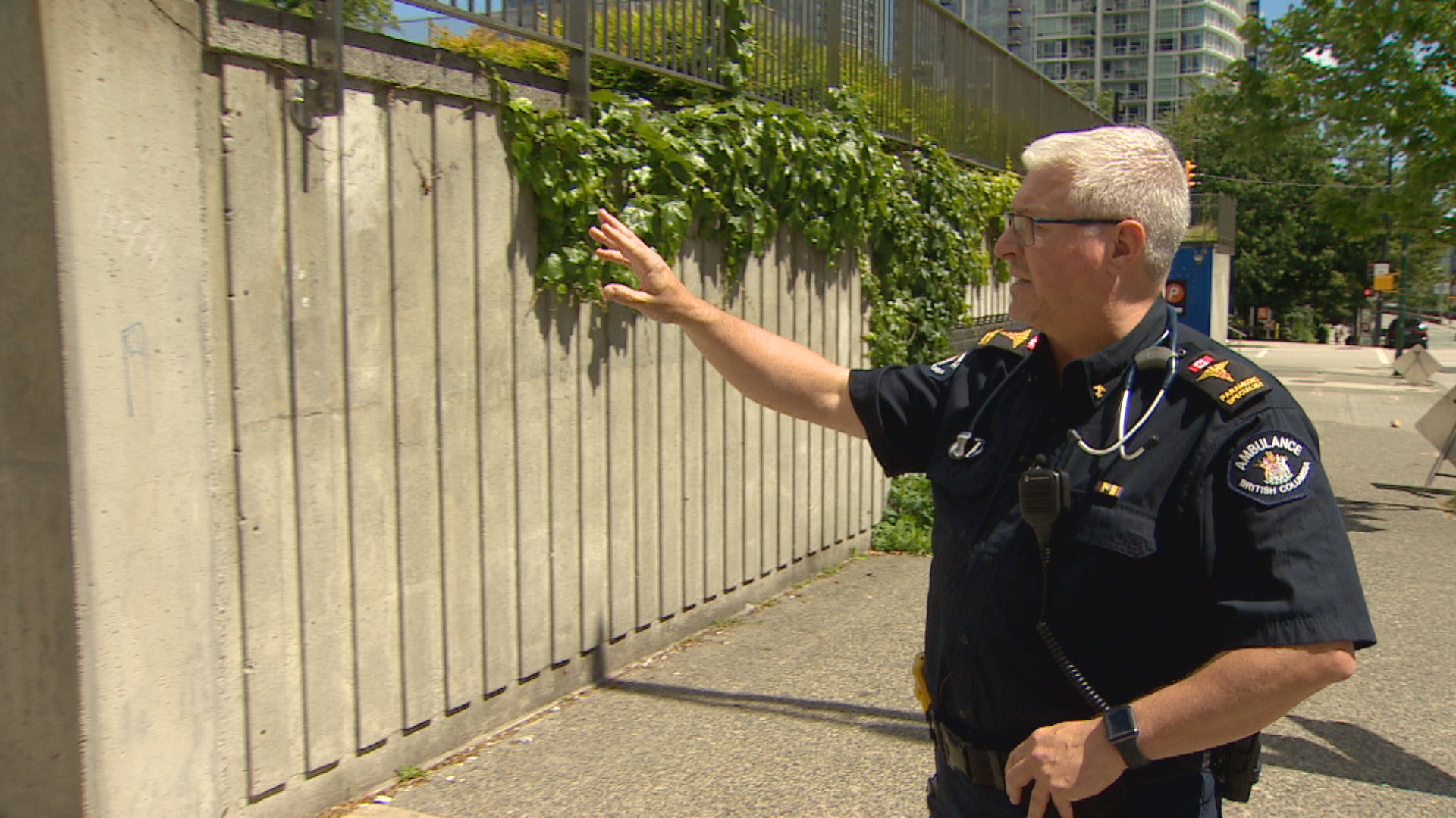 Paramedic Brian Twaites stands outside the Queen Elizabeth Plaza in 2021. In 2011, he stood at that spot holding a riot shield as the mob threw flower pots and beer at him and other first responders. (Christian Amundson/CBC)