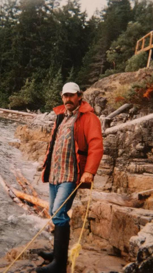 Krieger standing on some rocks with a rope while beachcombing in the late 1990s (Rob Predinchuk)