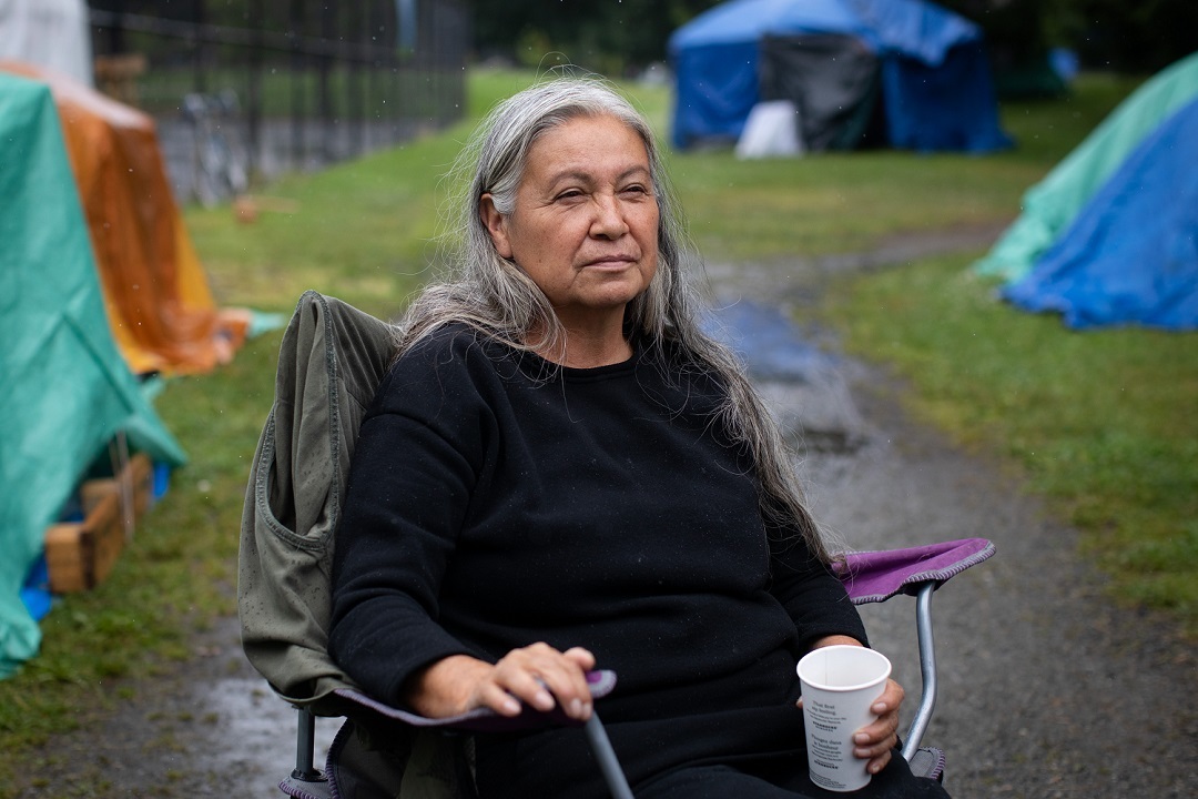 Veronica, an Anishinaabe woman and camp resident who identifies herself as the head firekeeper is pictured in Strathcona Park in July. (Maggie MacPherson)