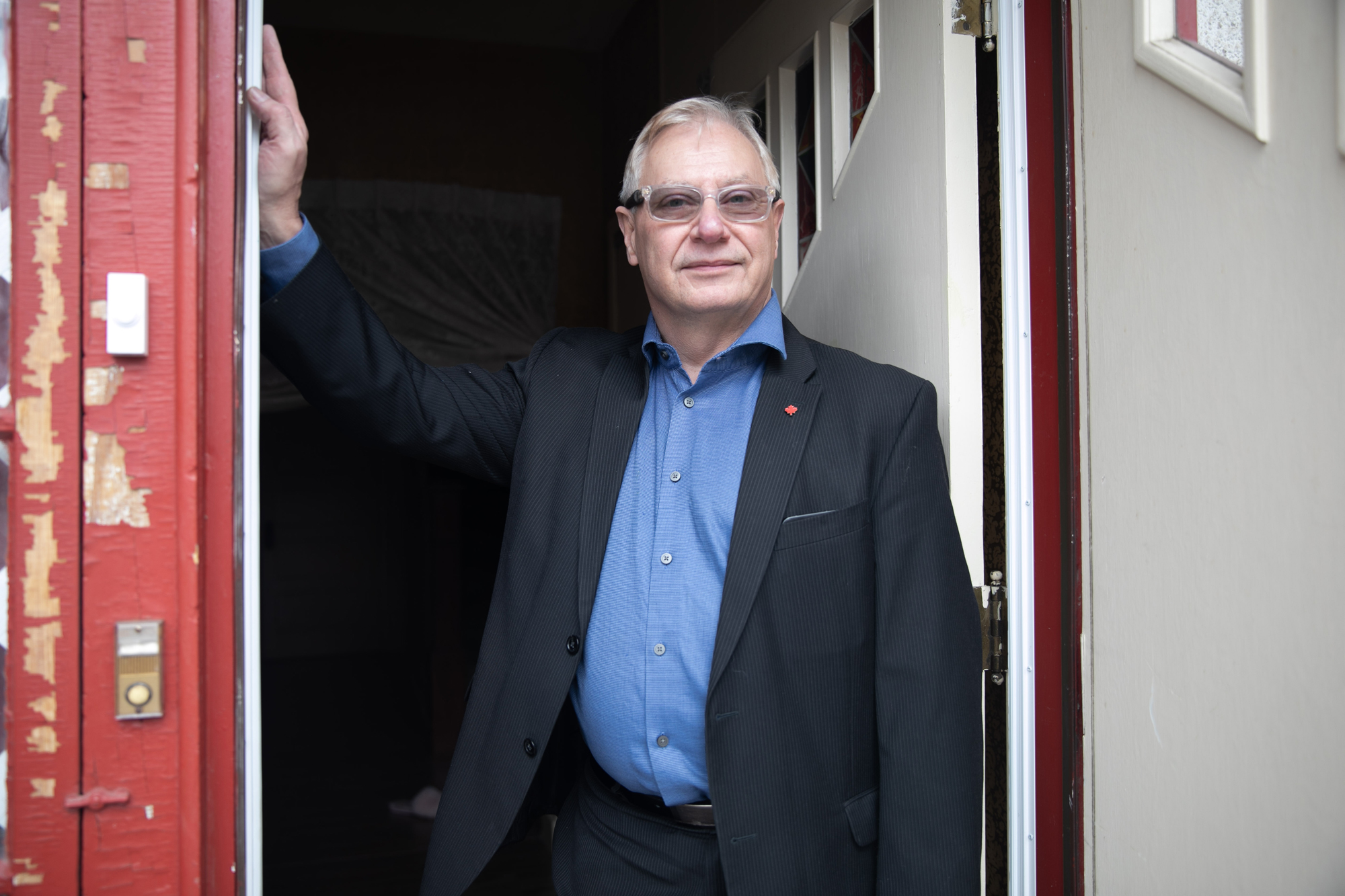 Wowk in the doorway of his Regina home. (Matthew Howard/CBC)