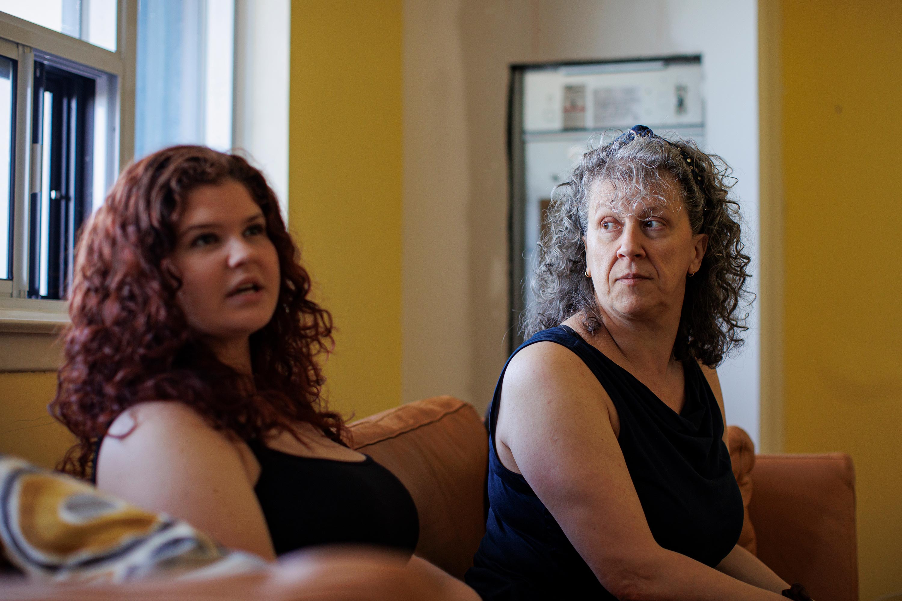 Bojana Nakic and her mom Gordana Jankovic are seated on a sofa.