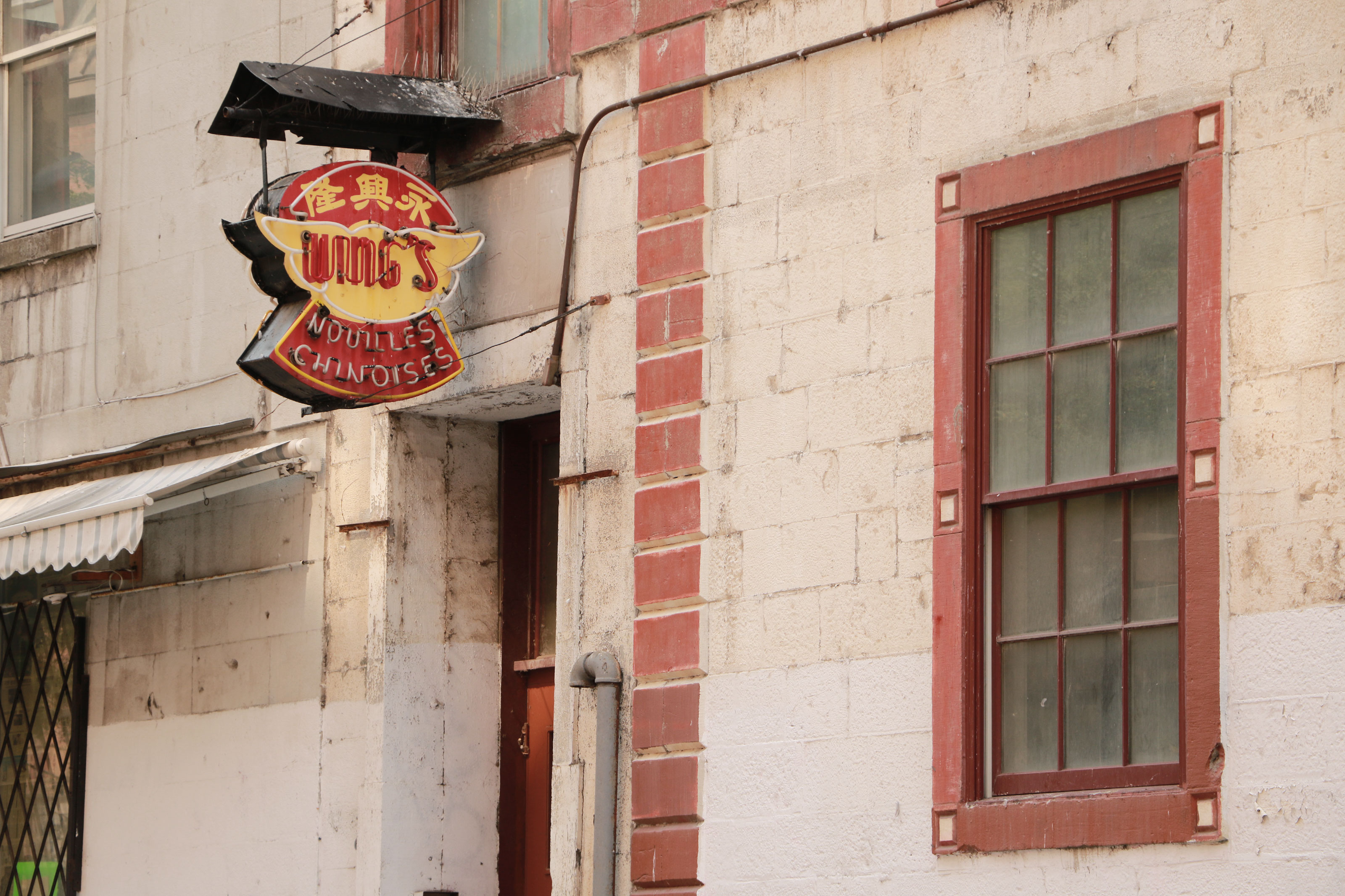 The Wings factory, at the corner of Rue De La Gauchetière Ouest and Rue Côté, is the oldest continuously running business in Chinatown. Over the years, the neighbouring buildings have been razed for the Montreal Convention Centre and the Guy-Favreau complex.